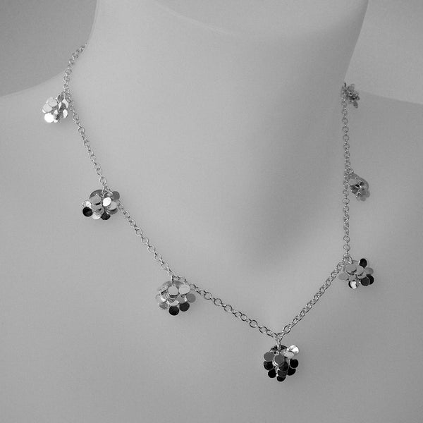Symphony charm Necklace, polished silver by Fiona DeMarco