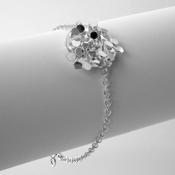 Symphony disc Bracelet, polished silver by Fiona DeMarco