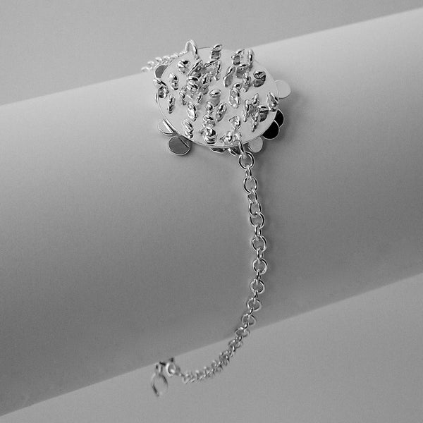 Symphony disc Bracelet reverse side, polished silver by Fiona DeMarco