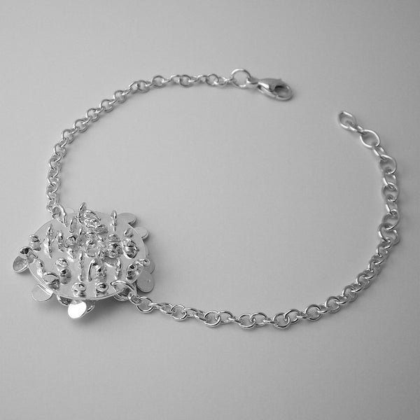 Symphony disc Bracelet reverse side, polished silver by Fiona DeMarco