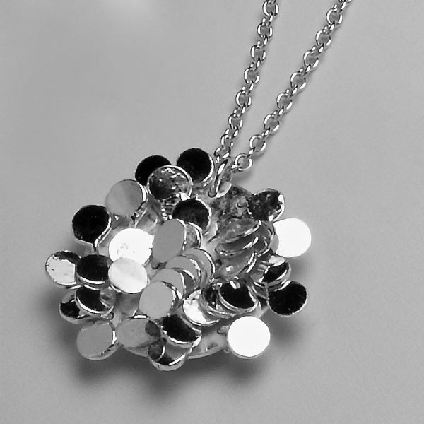 Symphony Pendant, polished silver by Fiona DeMarco