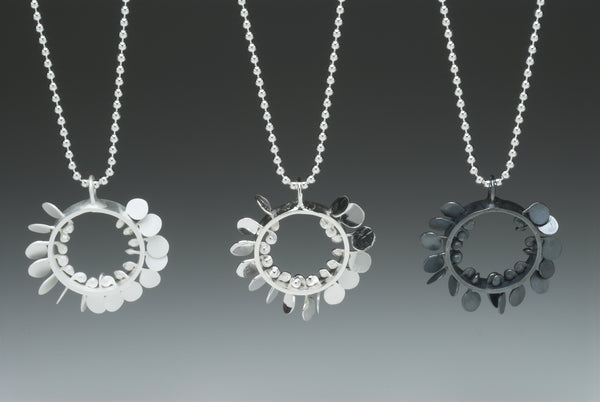 Icon Pendants, satin, polished and oxidised silver by Fiona DeMarco