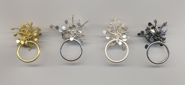 Signature Cluster rings, gold and silver by Fiona DeMarco