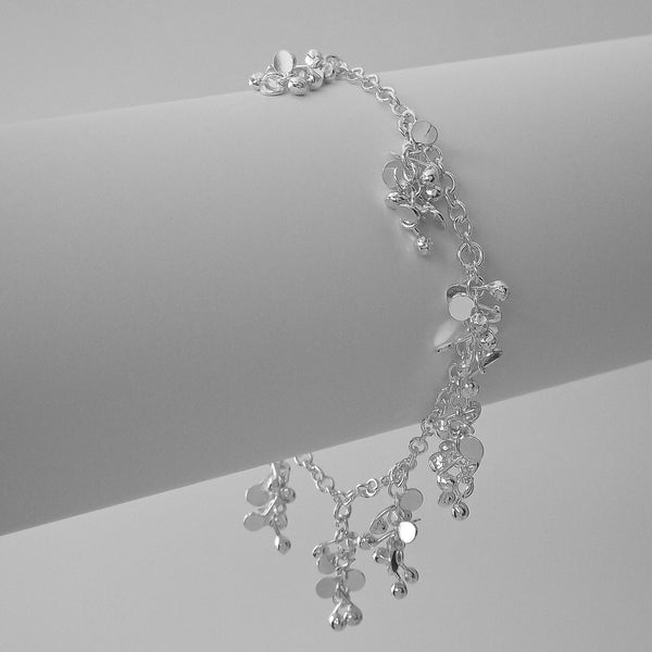 Harmony charm Bracelet, polished silver by Fiona DeMarco